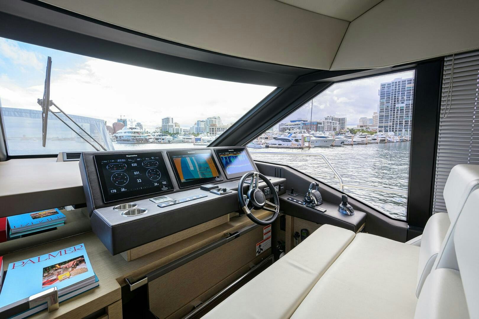 a room with a large window and a view of a city aboard 2016 68 PRESTIGE Yacht for Sale