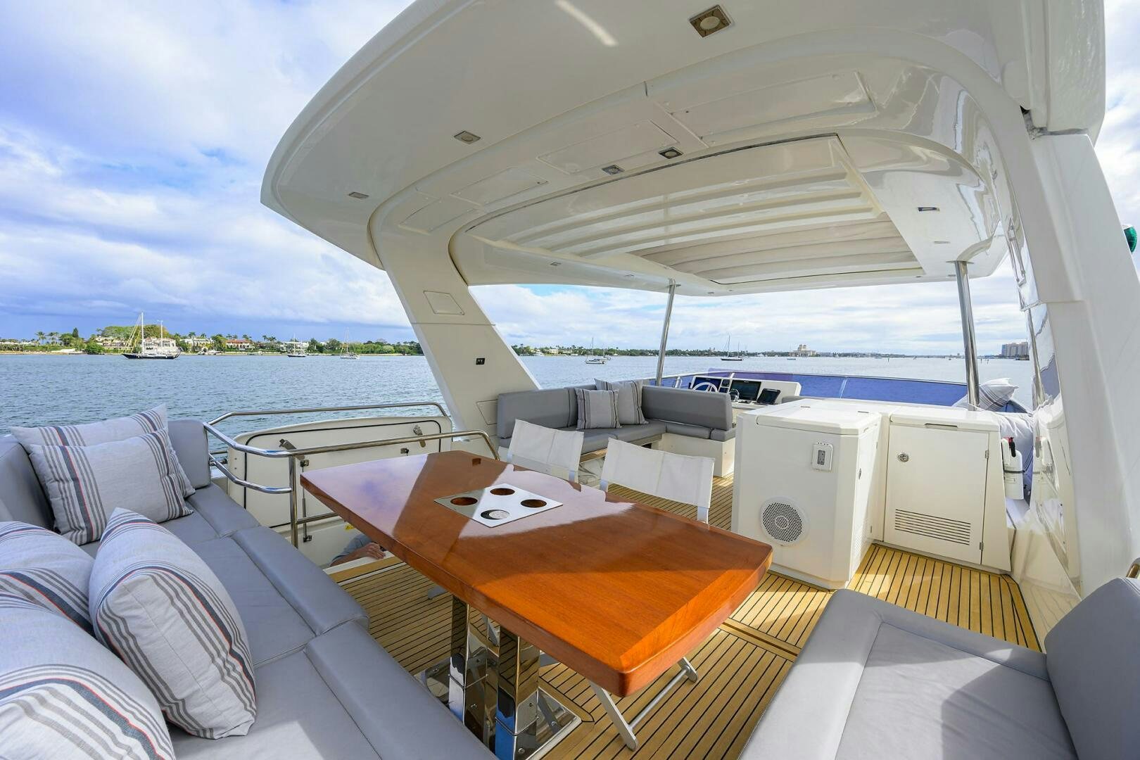 a boat with a table and a bed aboard 2016 68 PRESTIGE Yacht for Sale