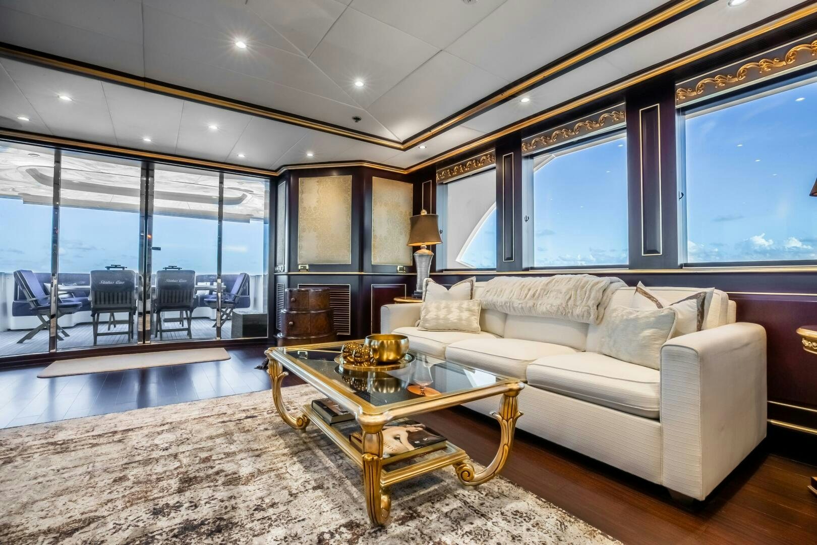 a living room with a large window aboard STATUS QUO Yacht for Sale