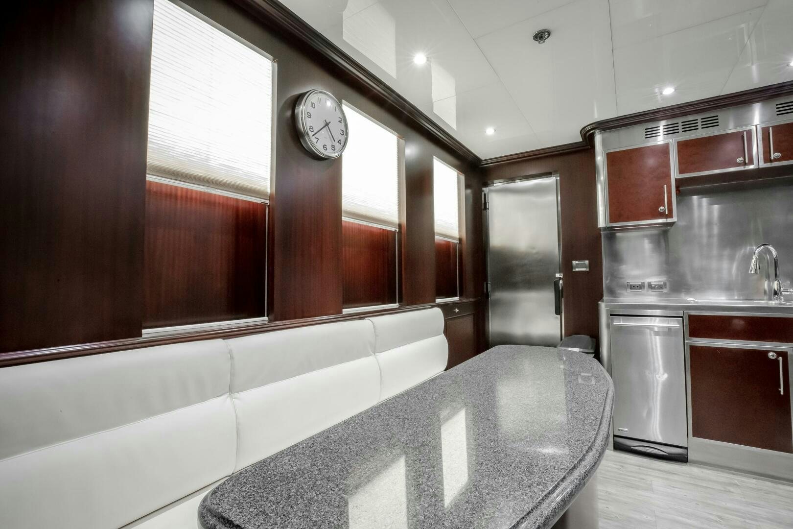 a kitchen with a large island aboard STATUS QUO Yacht for Sale