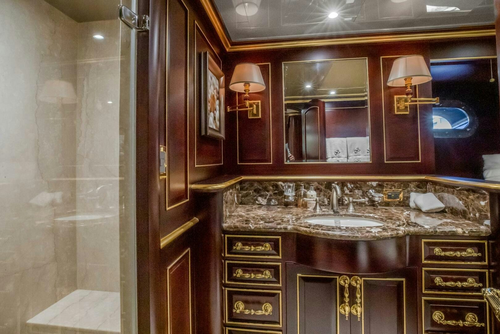 a bathroom with a large mirror aboard STATUS QUO Yacht for Sale
