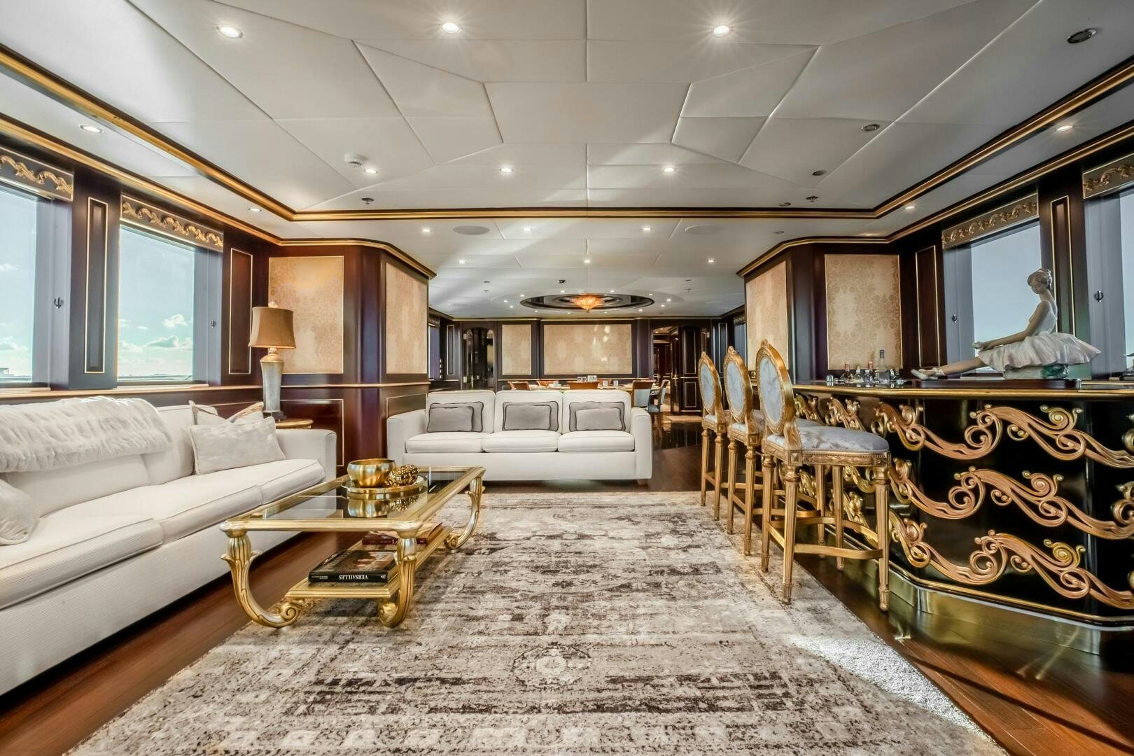 a large living room with a large mirror aboard STATUS QUO Yacht for Sale