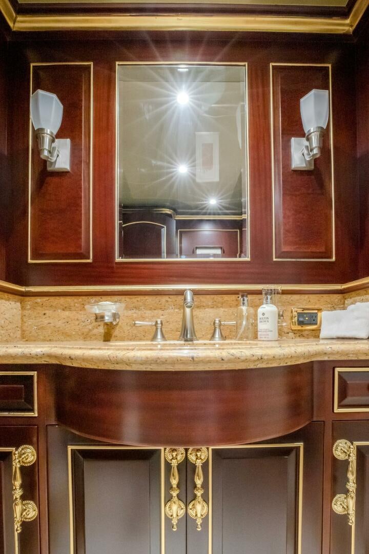 a bathroom with a large mirror aboard STATUS QUO Yacht for Sale