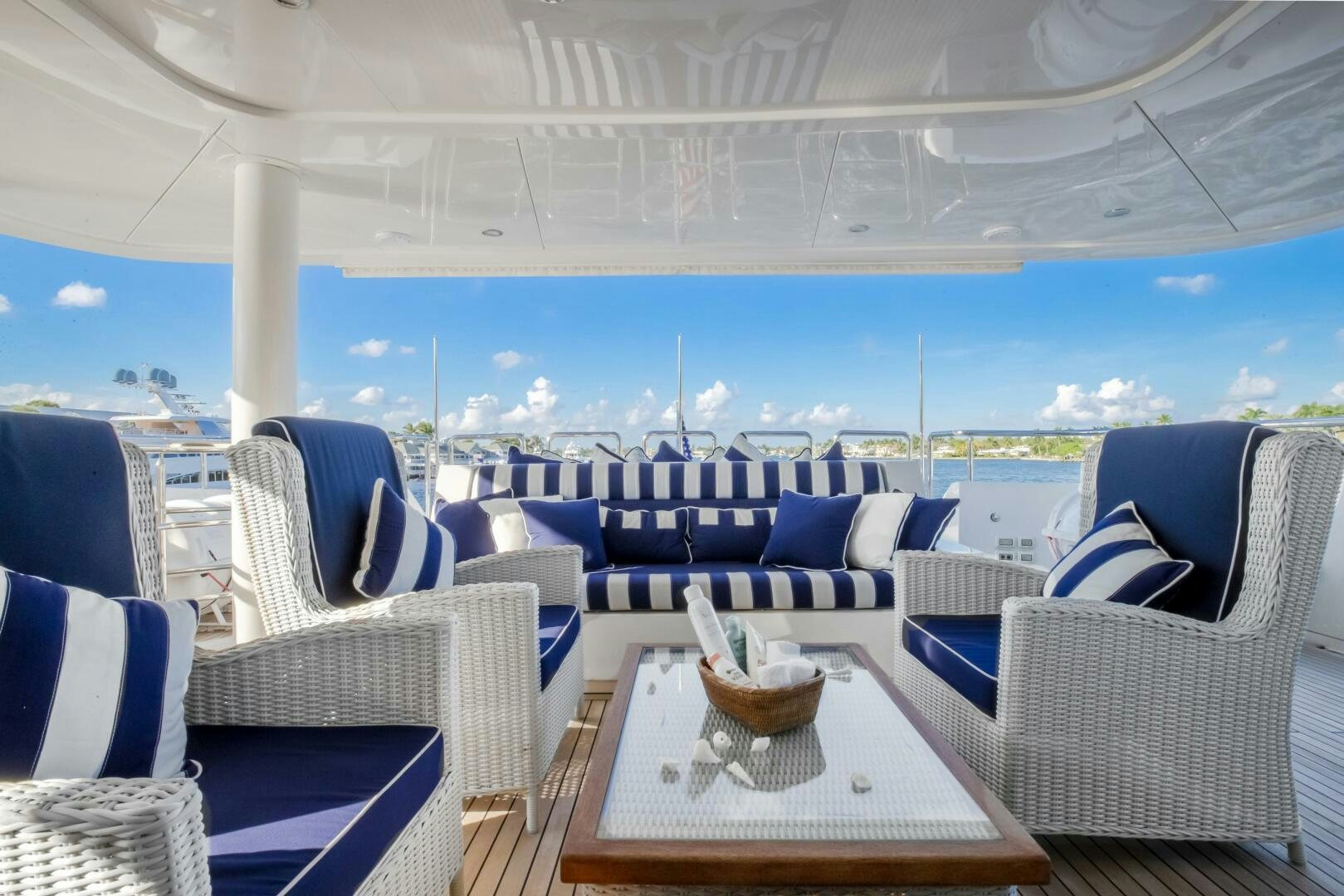a room with a table chairs and a large window aboard STATUS QUO Yacht for Sale