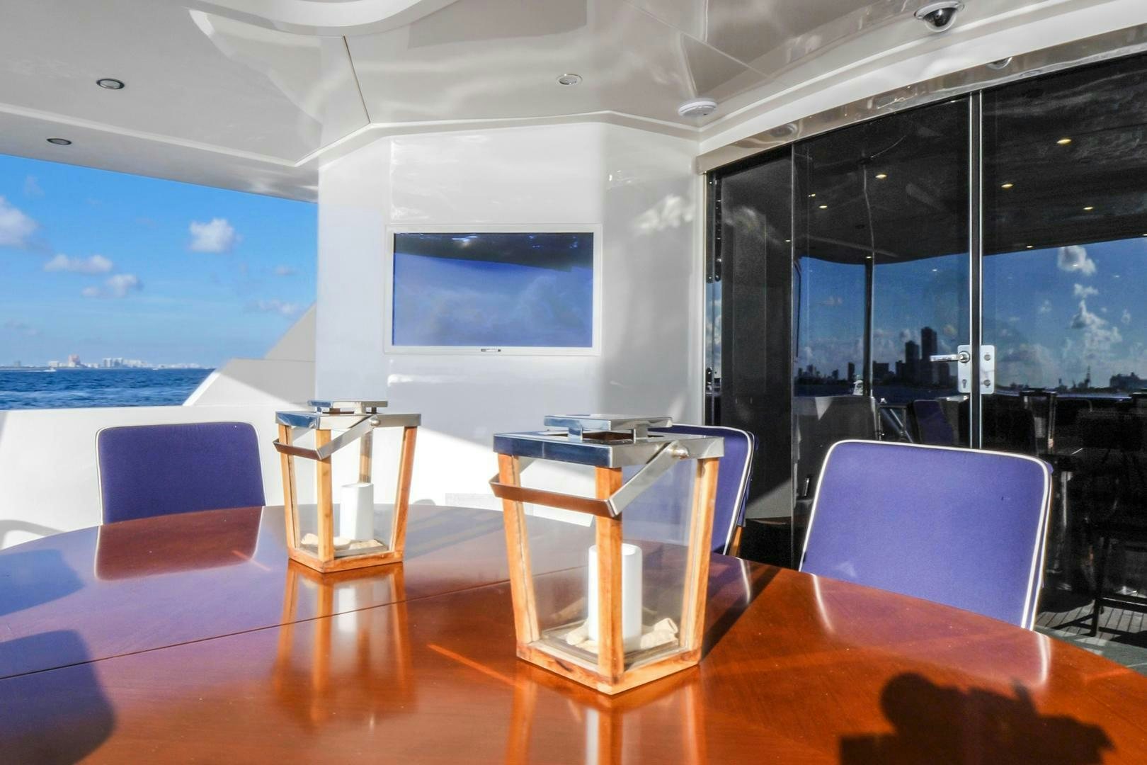 a room with a table and chairs aboard STATUS QUO Yacht for Sale