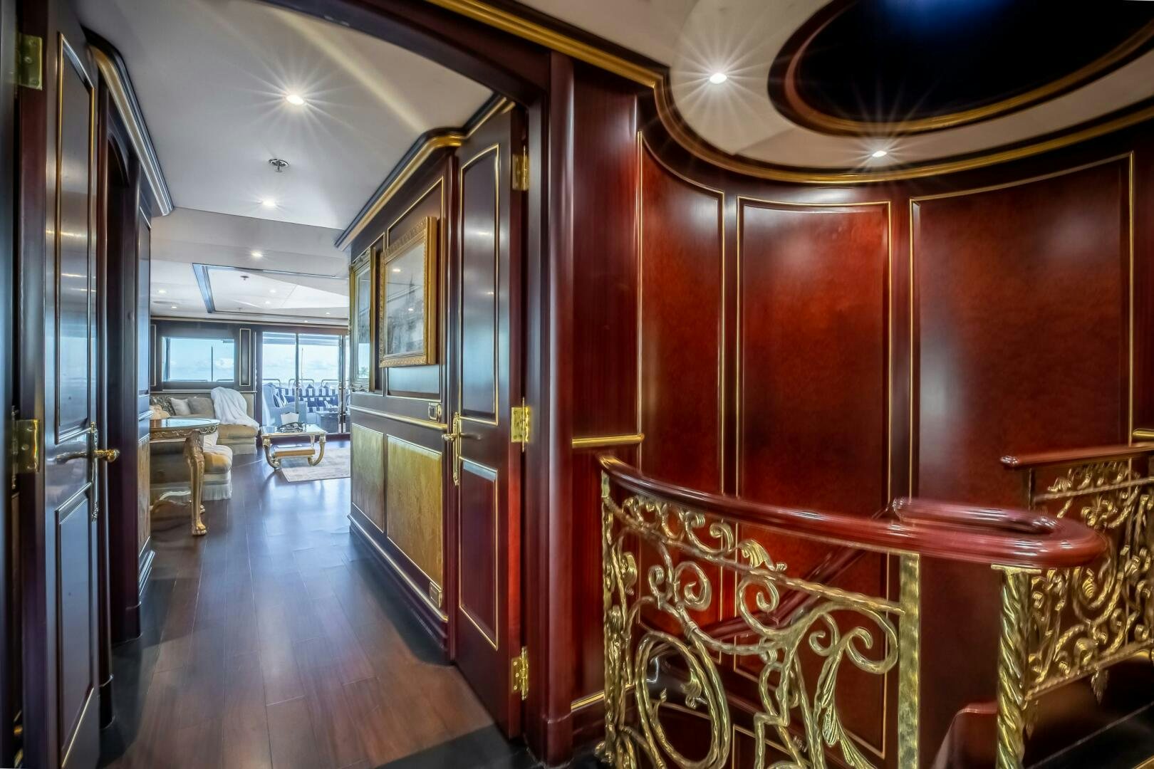 a room with a wood wall and a wood door aboard STATUS QUO Yacht for Sale