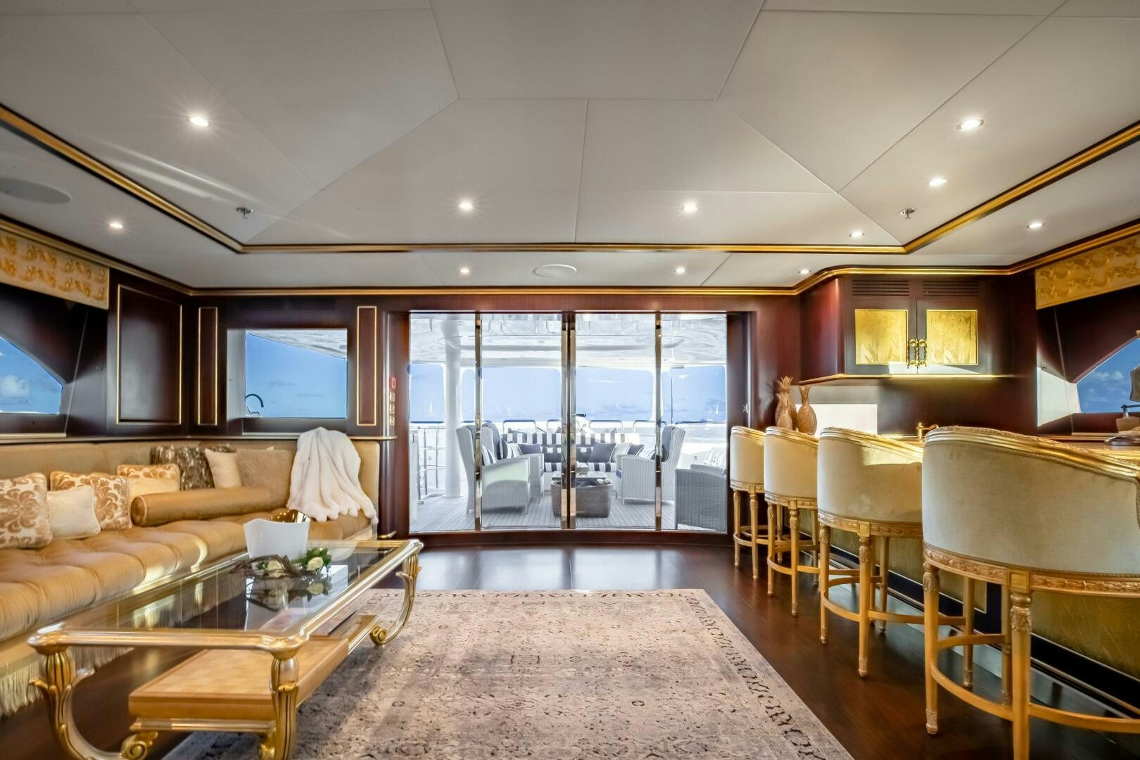a large living room with a large window aboard STATUS QUO Yacht for Sale