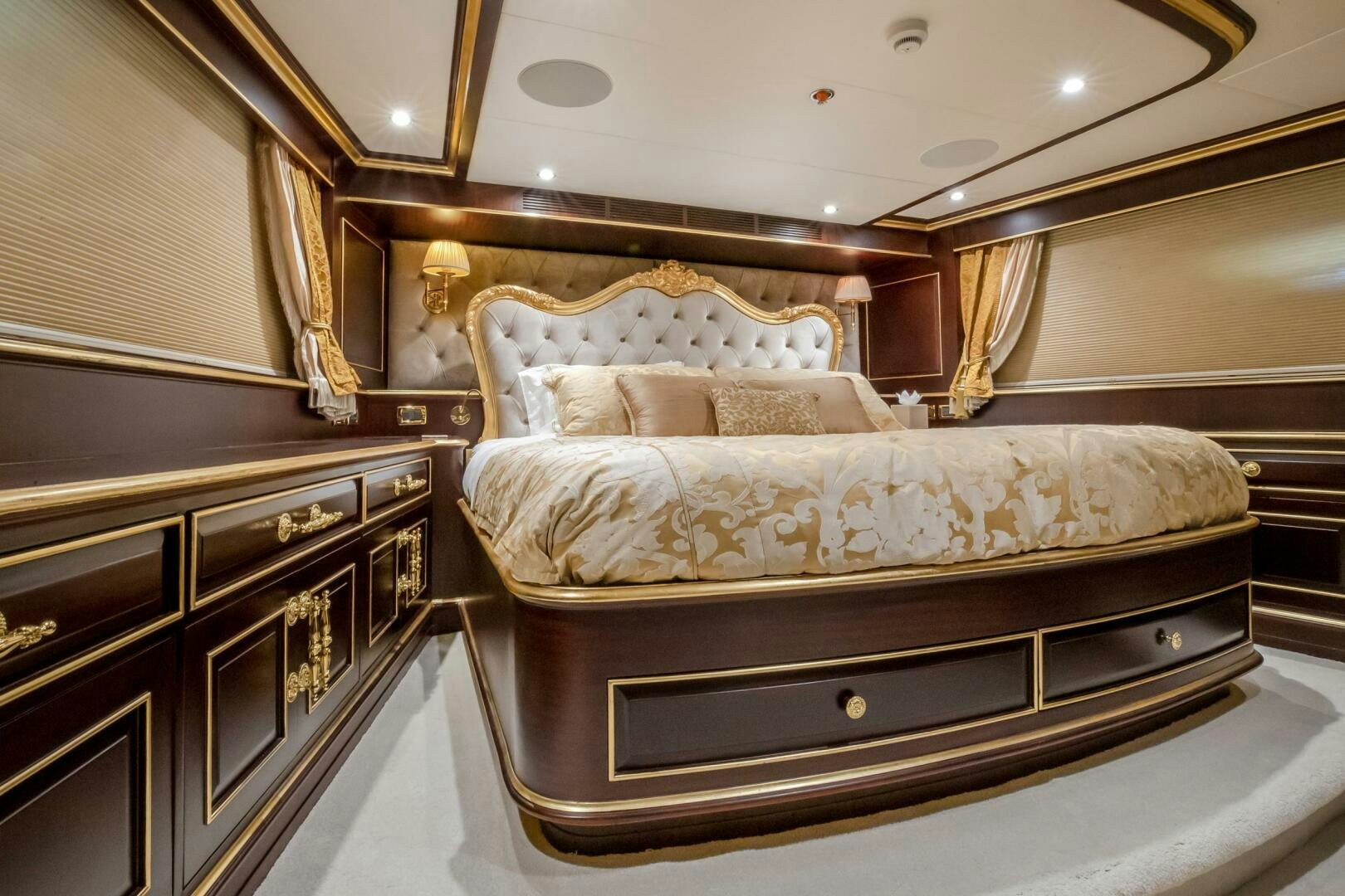 a bed with a mirror above it aboard STATUS QUO Yacht for Sale