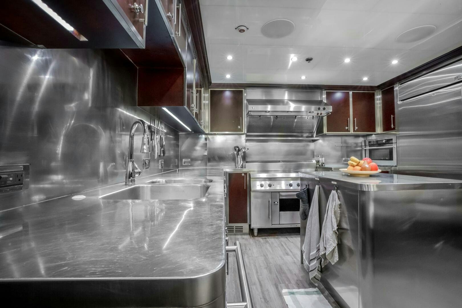 a kitchen with a large island aboard STATUS QUO Yacht for Sale
