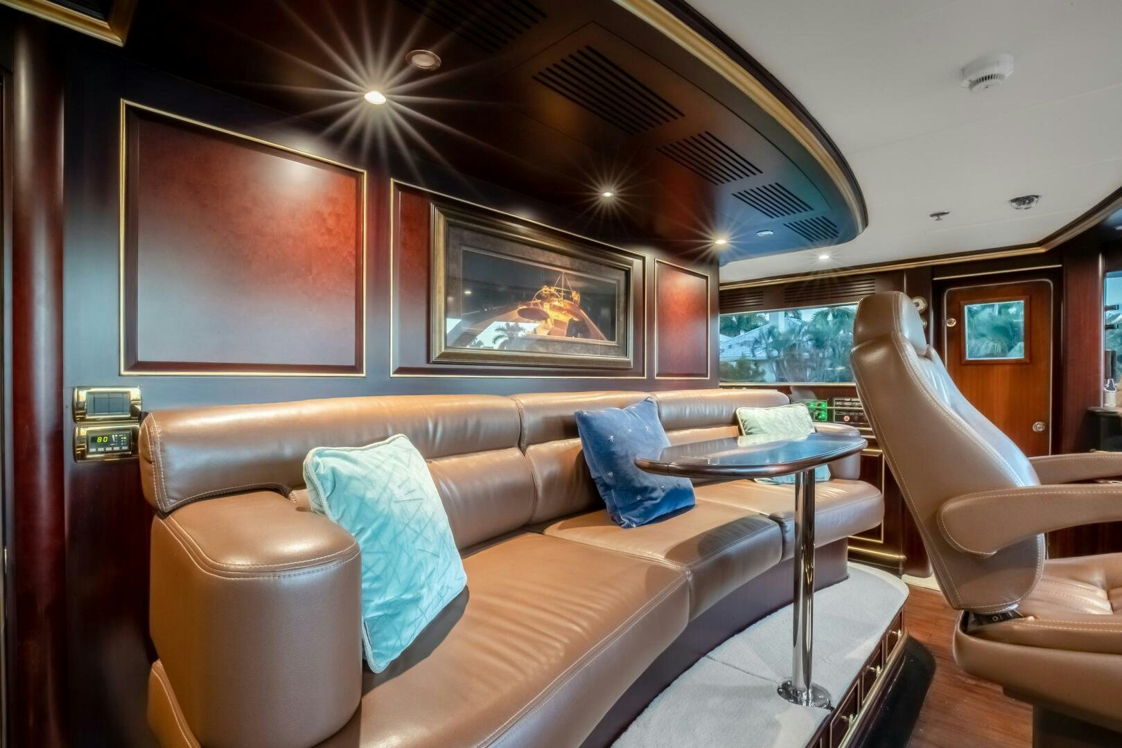 a living room with a couch and a television aboard STATUS QUO Yacht for Sale