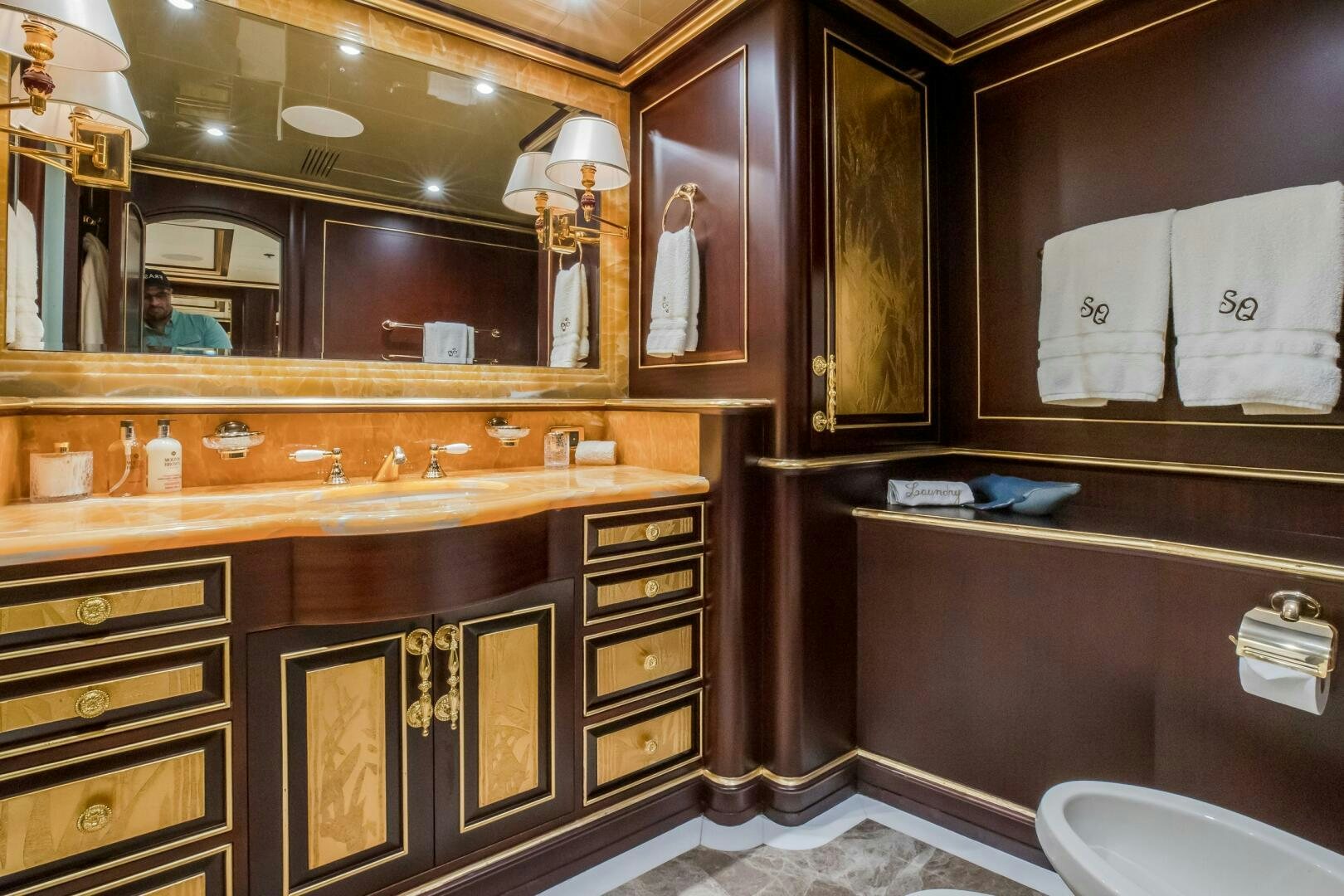 a bathroom with a large mirror aboard STATUS QUO Yacht for Sale