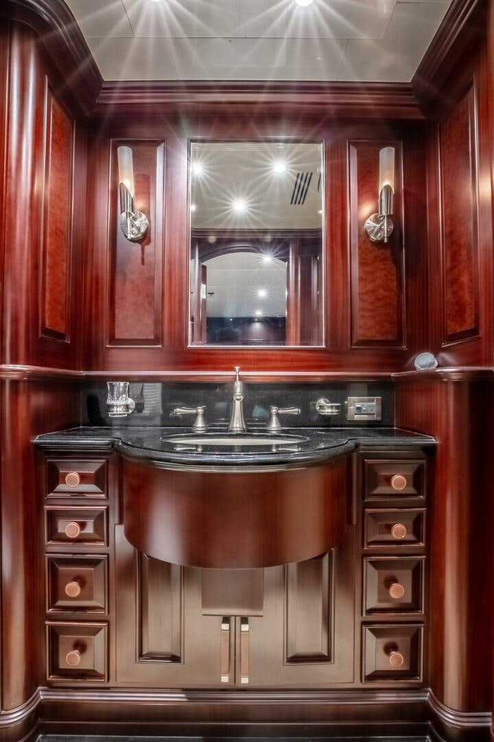 a large kitchen with a large mirror aboard STATUS QUO Yacht for Sale