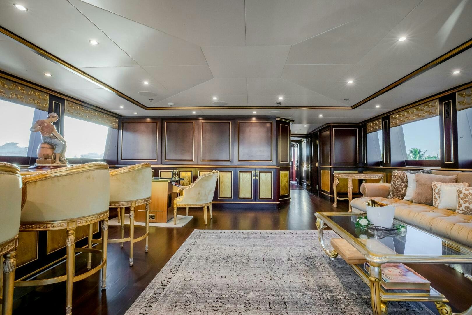 a large living room with a large mirror aboard STATUS QUO Yacht for Sale