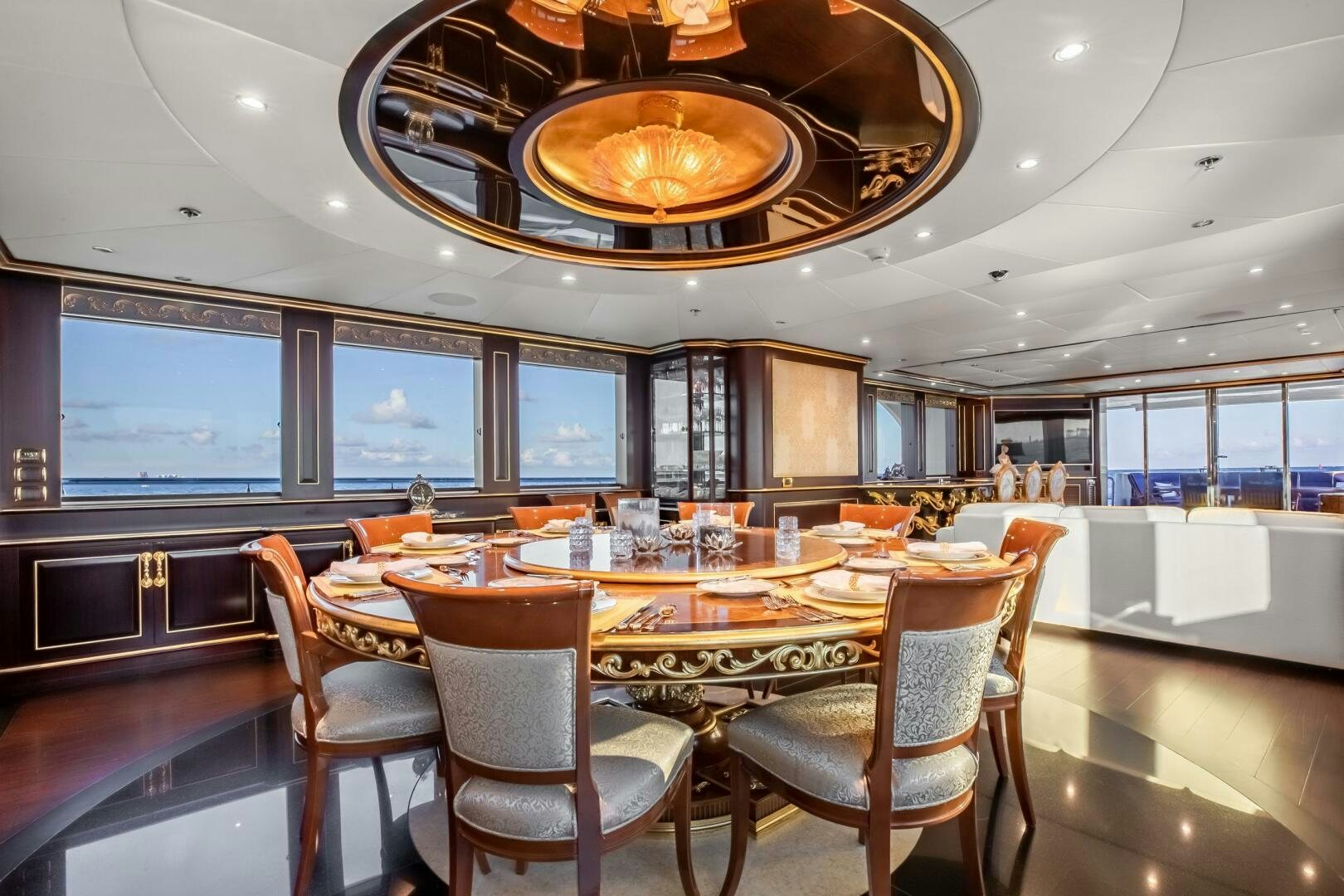 a large dining room with a large table and chairs aboard STATUS QUO Yacht for Sale