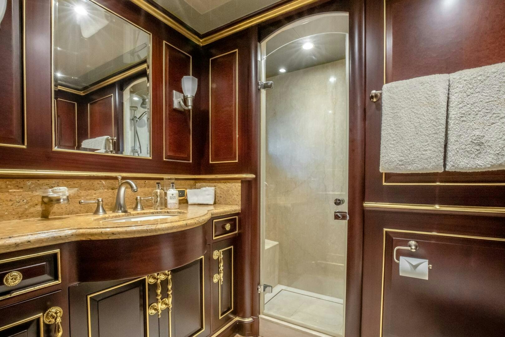 a bathroom with a sink and a mirror aboard STATUS QUO Yacht for Sale