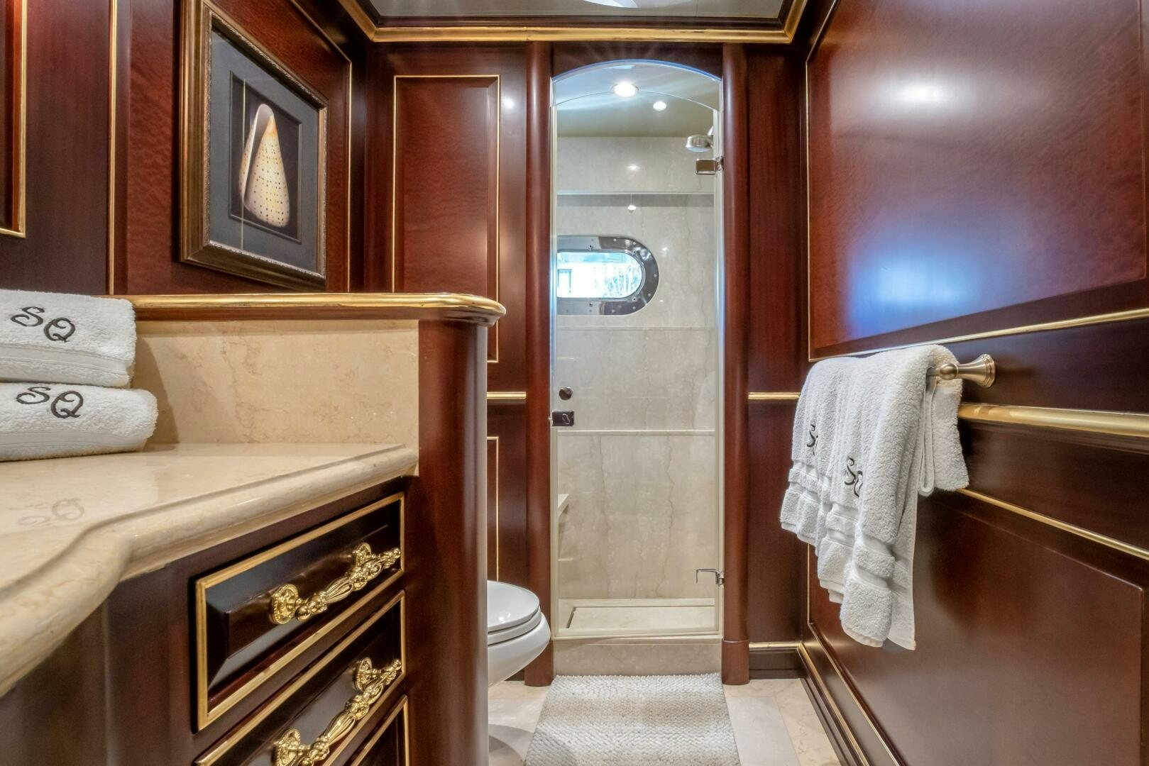 a bathroom with a bathtub and toilet aboard STATUS QUO Yacht for Sale