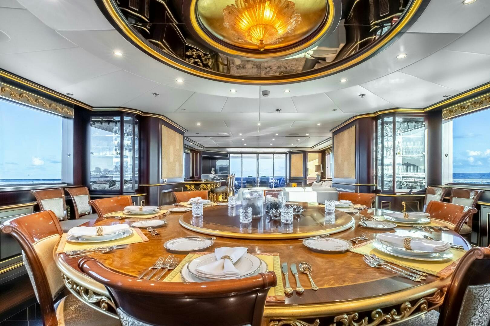 a large dining room with a large table and chairs aboard STATUS QUO Yacht for Sale