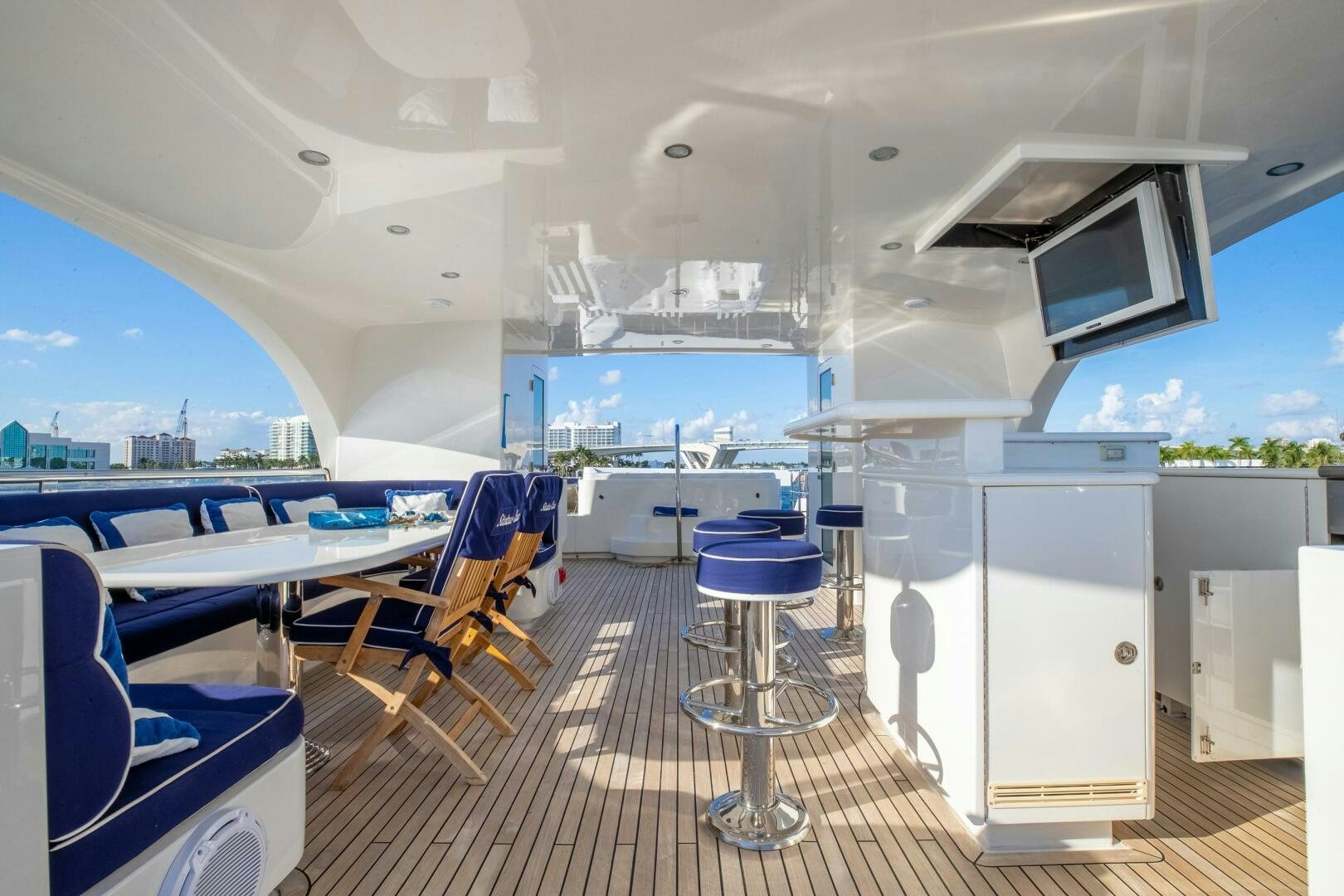 a room with a table chairs and a large window aboard STATUS QUO Yacht for Sale