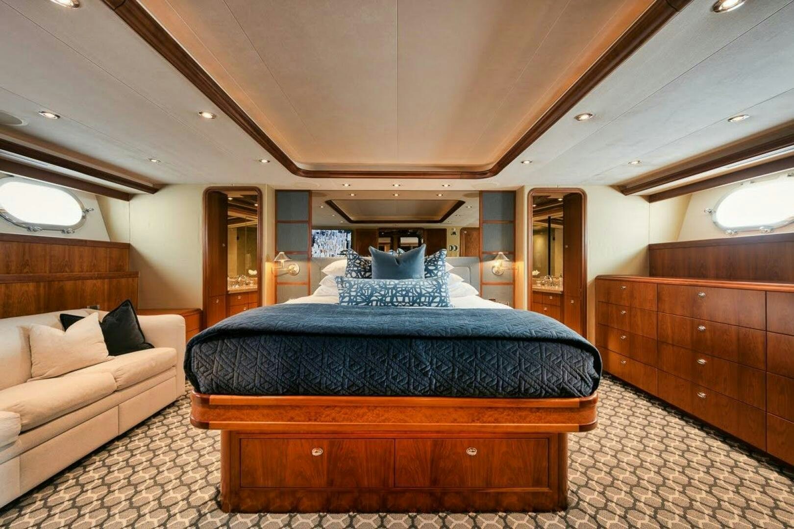 a large bed in a room aboard SLEEPOVER Yacht for Sale
