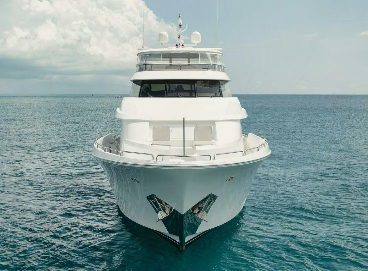 a white boat in the water aboard SLEEPOVER Yacht for Sale