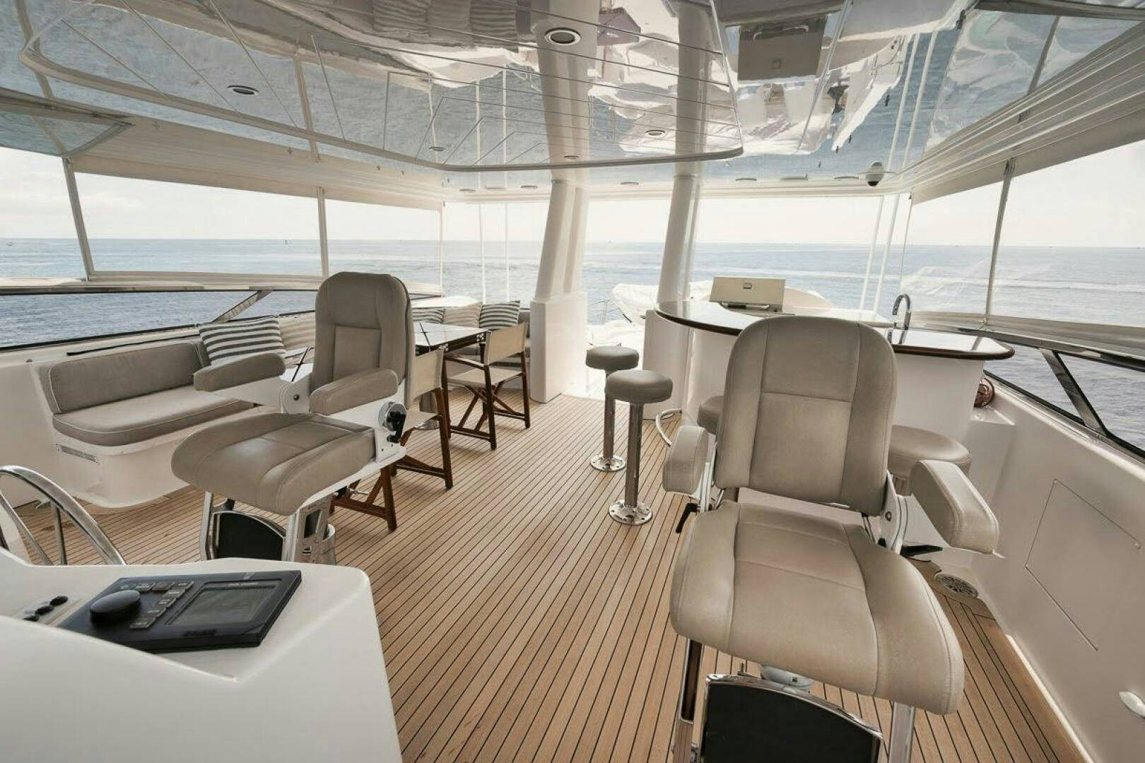 a boat with a desk and chairs aboard SLEEPOVER Yacht for Sale