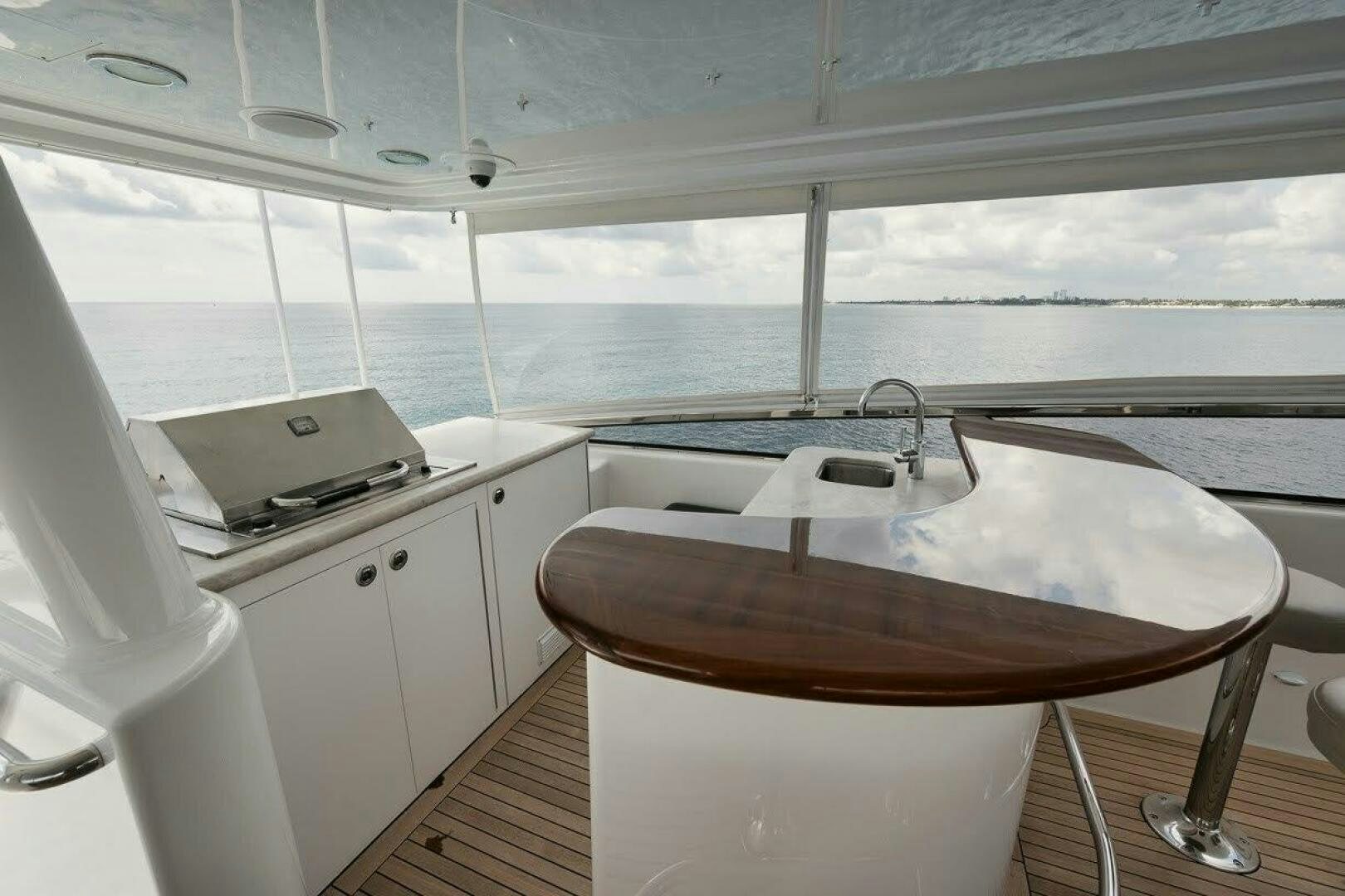 a kitchen with a table and a sink aboard SLEEPOVER Yacht for Sale