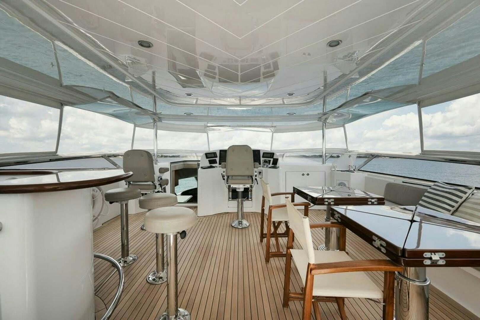 a room with chairs and tables aboard SLEEPOVER Yacht for Sale