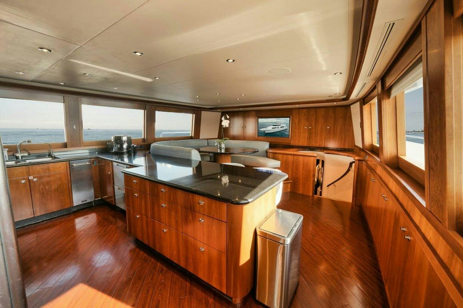 a kitchen with wooden cabinets aboard SLEEPOVER Yacht for Sale