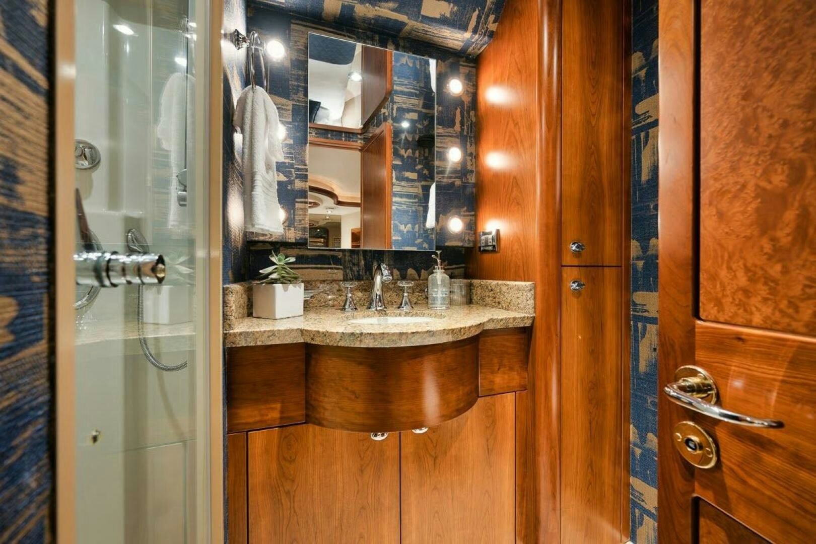 a bathroom with a sink and a mirror aboard SLEEPOVER Yacht for Sale