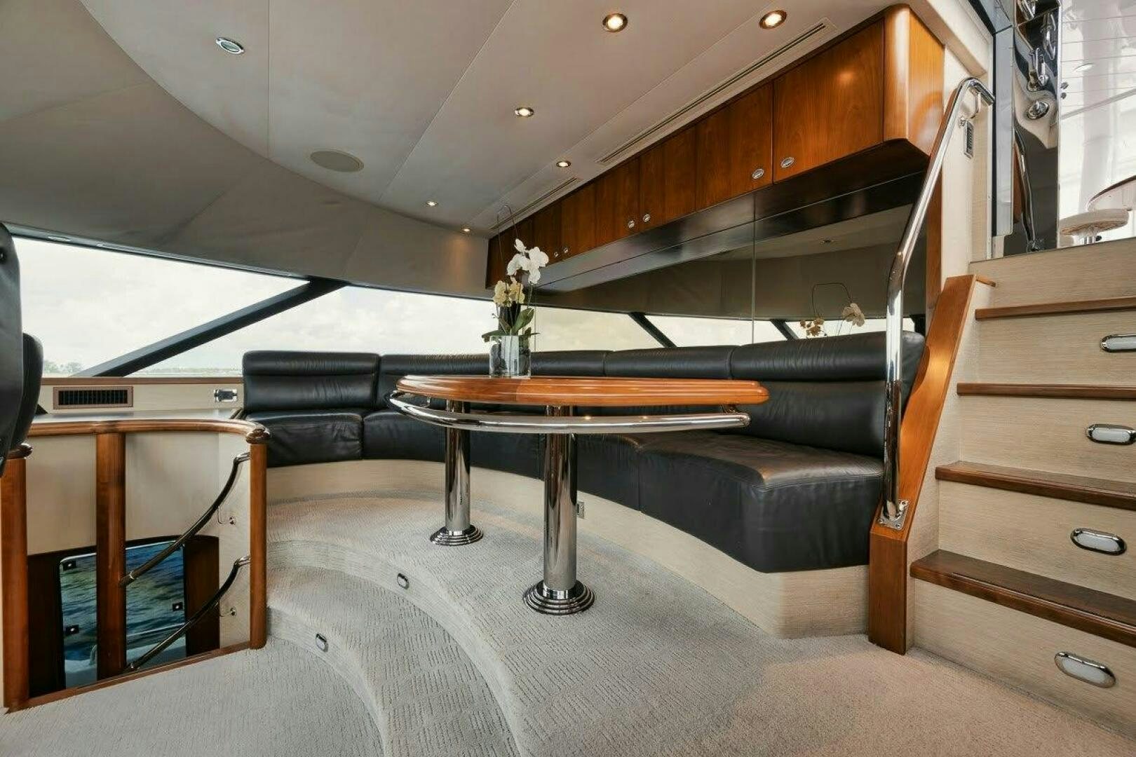 a room with a table and a couch aboard SLEEPOVER Yacht for Sale