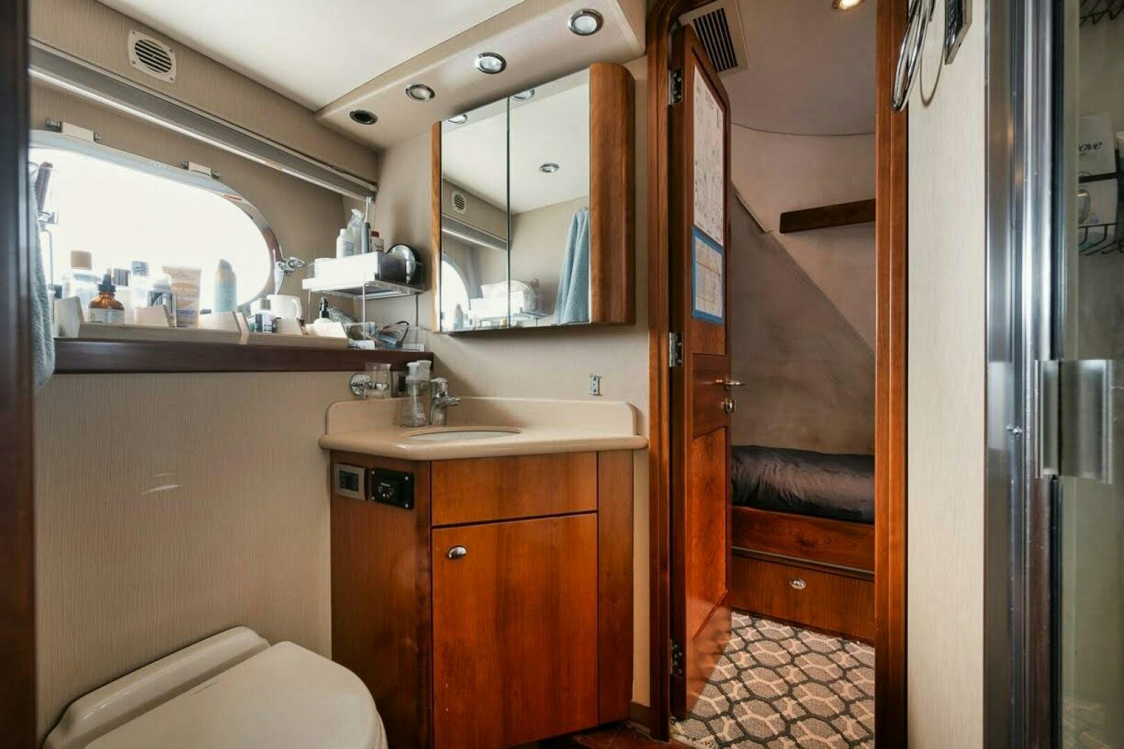 a bathroom with a sink and a mirror aboard SLEEPOVER Yacht for Sale