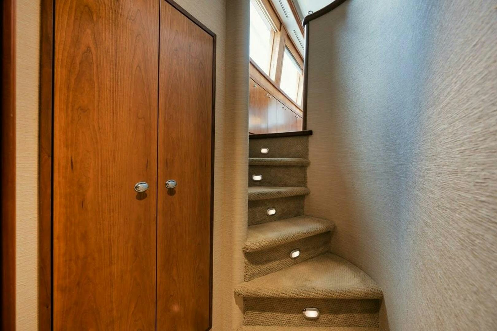 a wooden door with a wood cabinet aboard SLEEPOVER Yacht for Sale