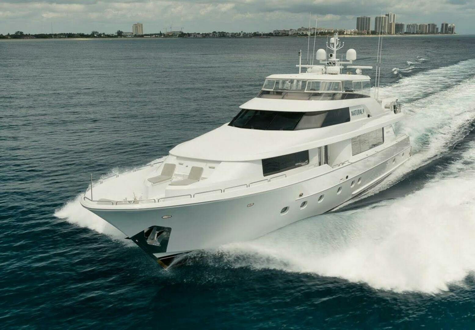 a white yacht on the water aboard SLEEPOVER Yacht for Sale