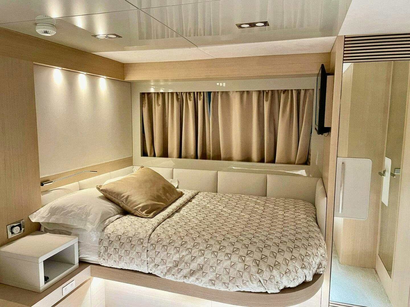a bed with white sheets aboard MISS TER Yacht for Sale