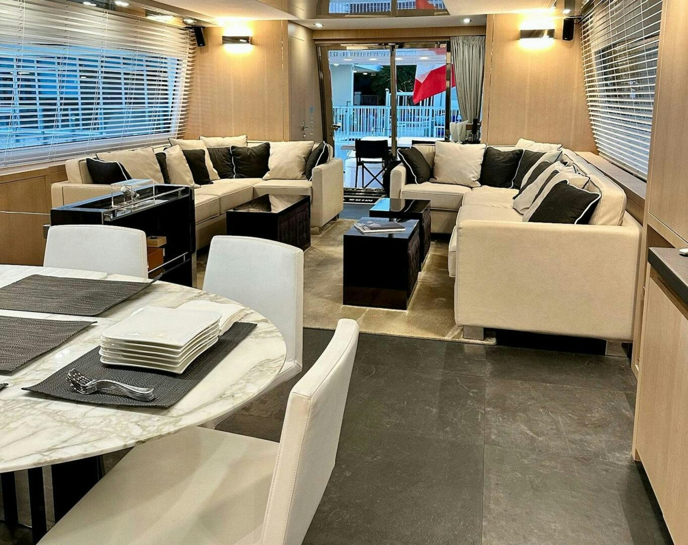a living room with a couch and a table aboard MISS TER Yacht for Sale