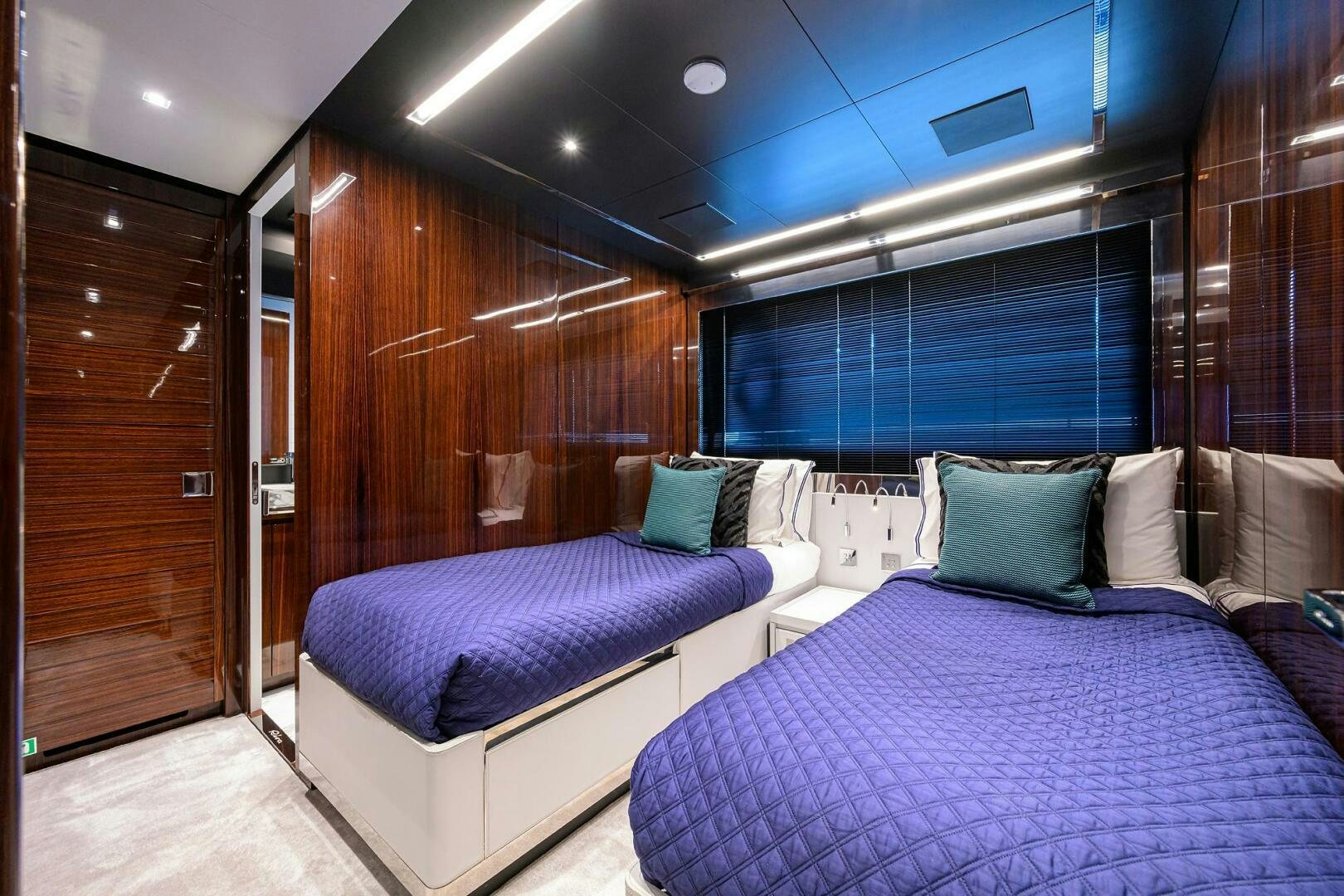 a room with a bed and a mirror aboard 90 RIVA 2023 Yacht for Sale