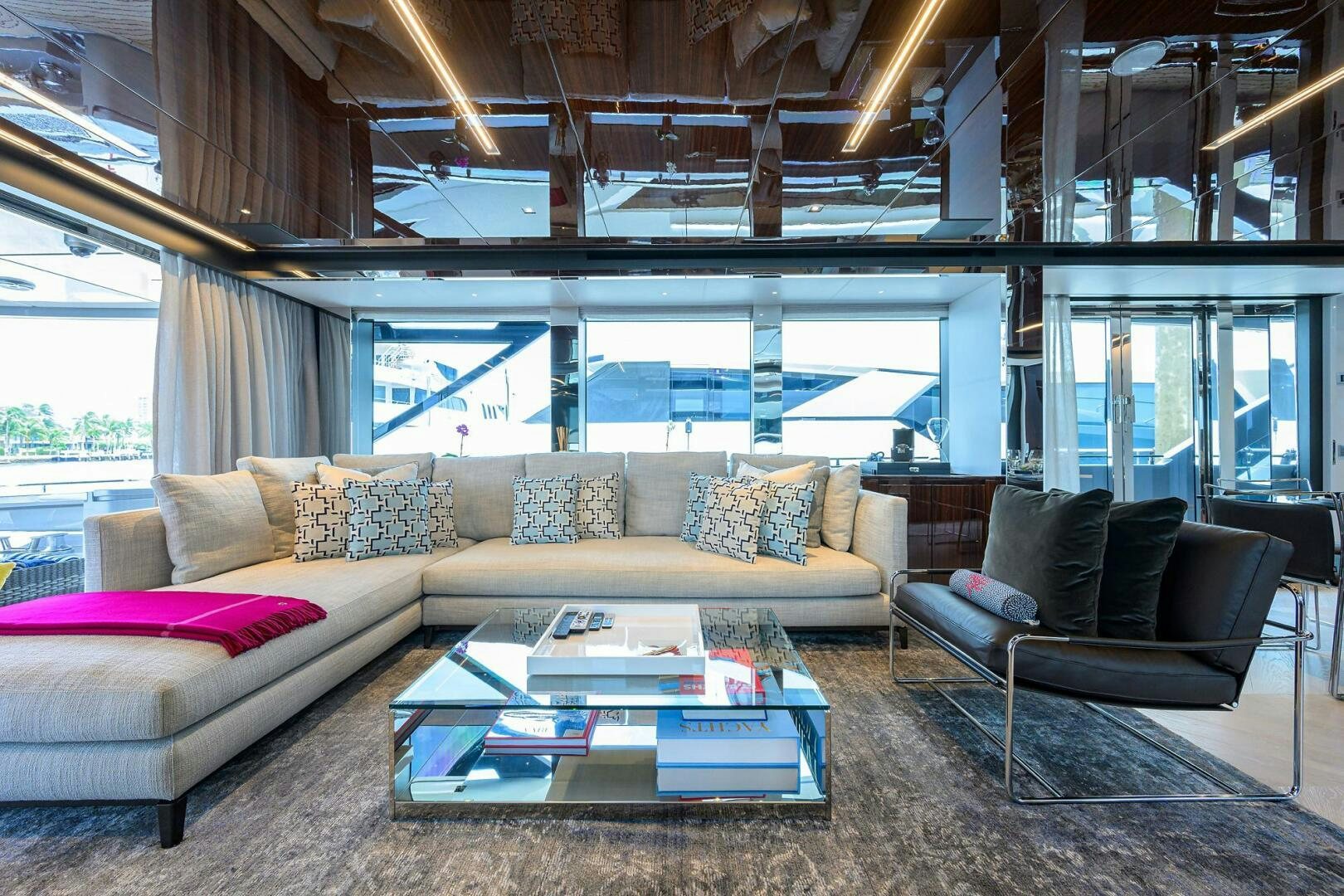 a living room with a large window aboard 90 RIVA 2023 Yacht for Sale