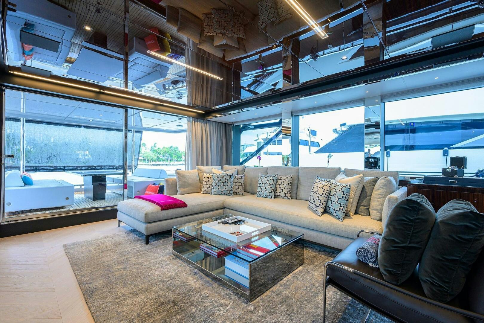 a living room with a large window aboard 90 RIVA 2023 Yacht for Sale