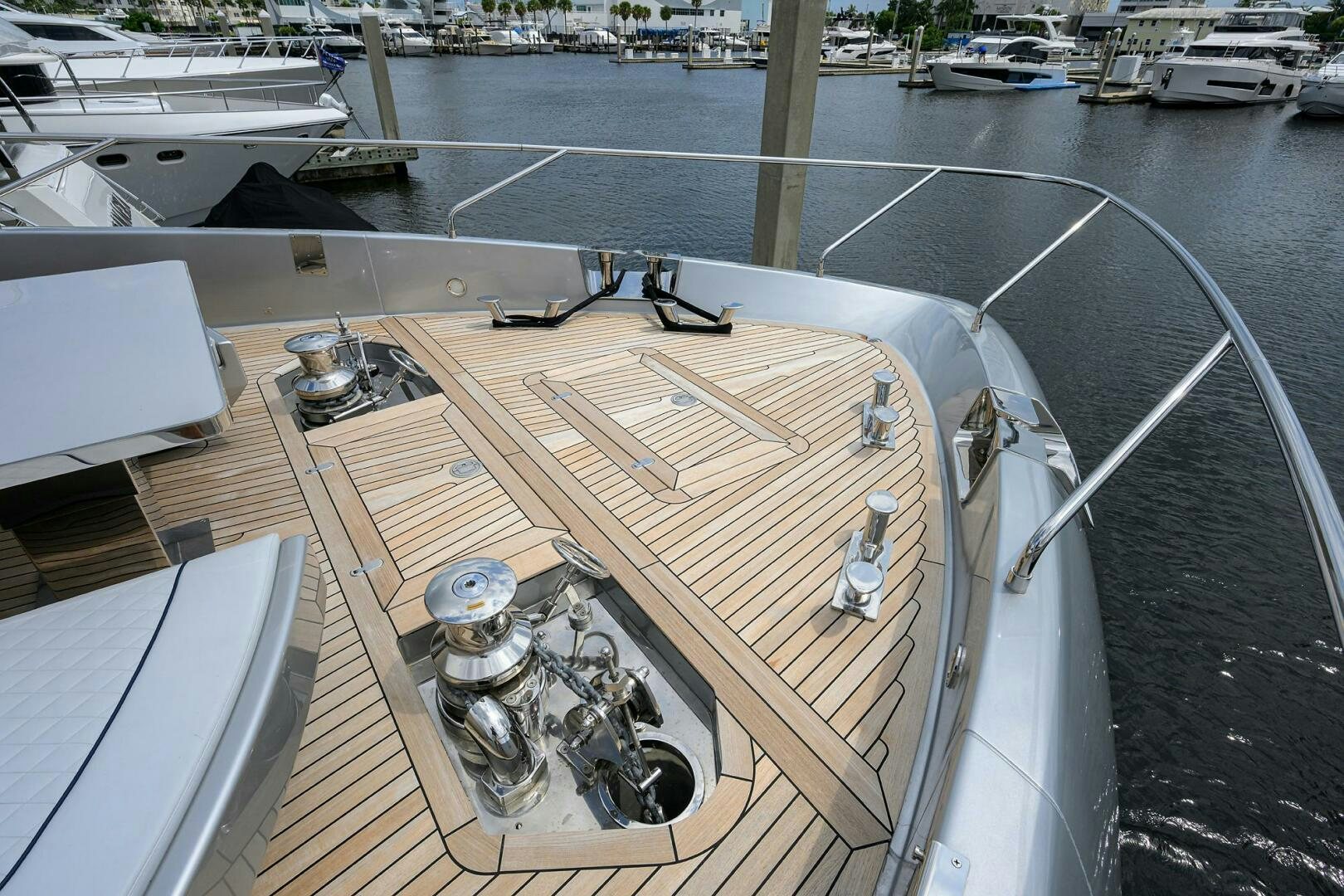 a large wooden boat on a dock aboard 90 RIVA 2023 Yacht for Sale