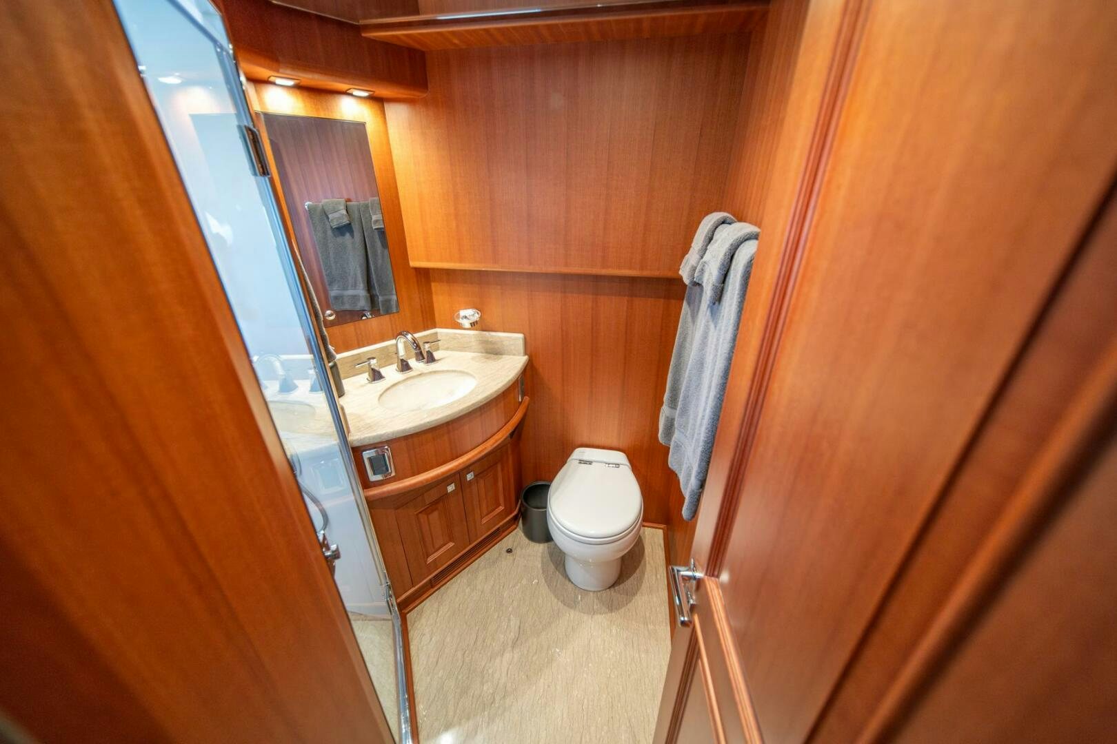 a bathroom with wooden walls aboard ABRI SUR LA MER Yacht for Sale