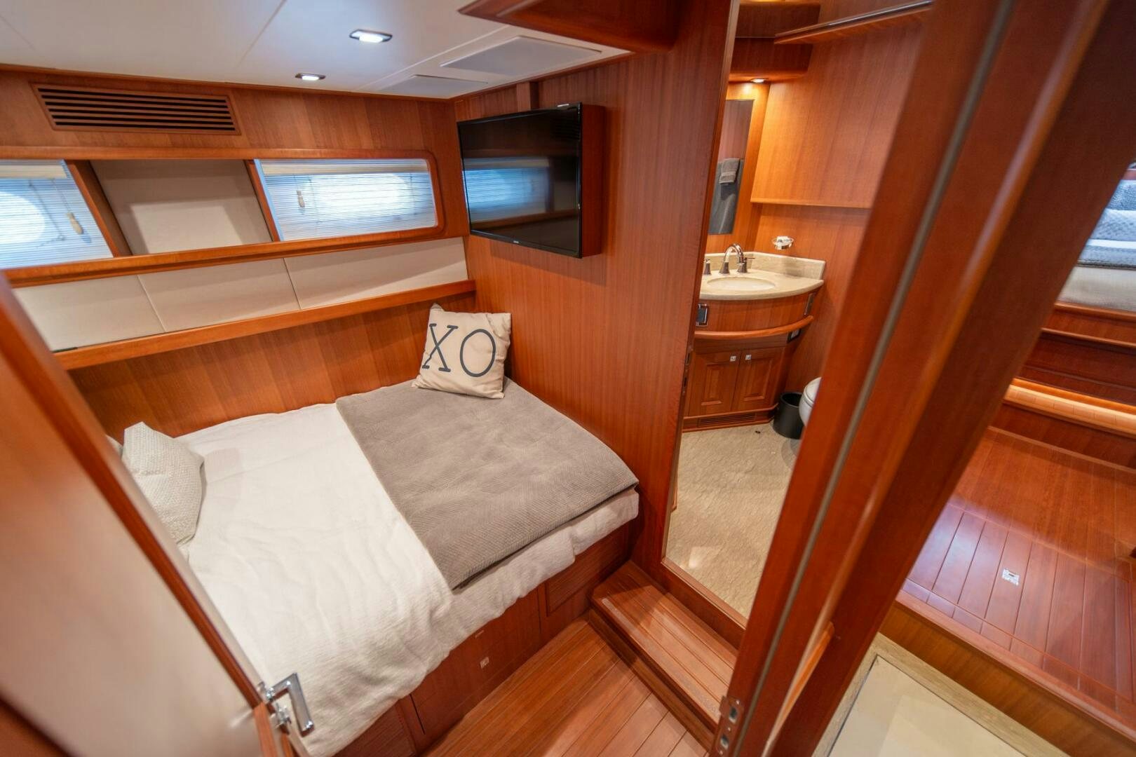 a bed in a cabin aboard ABRI SUR LA MER Yacht for Sale