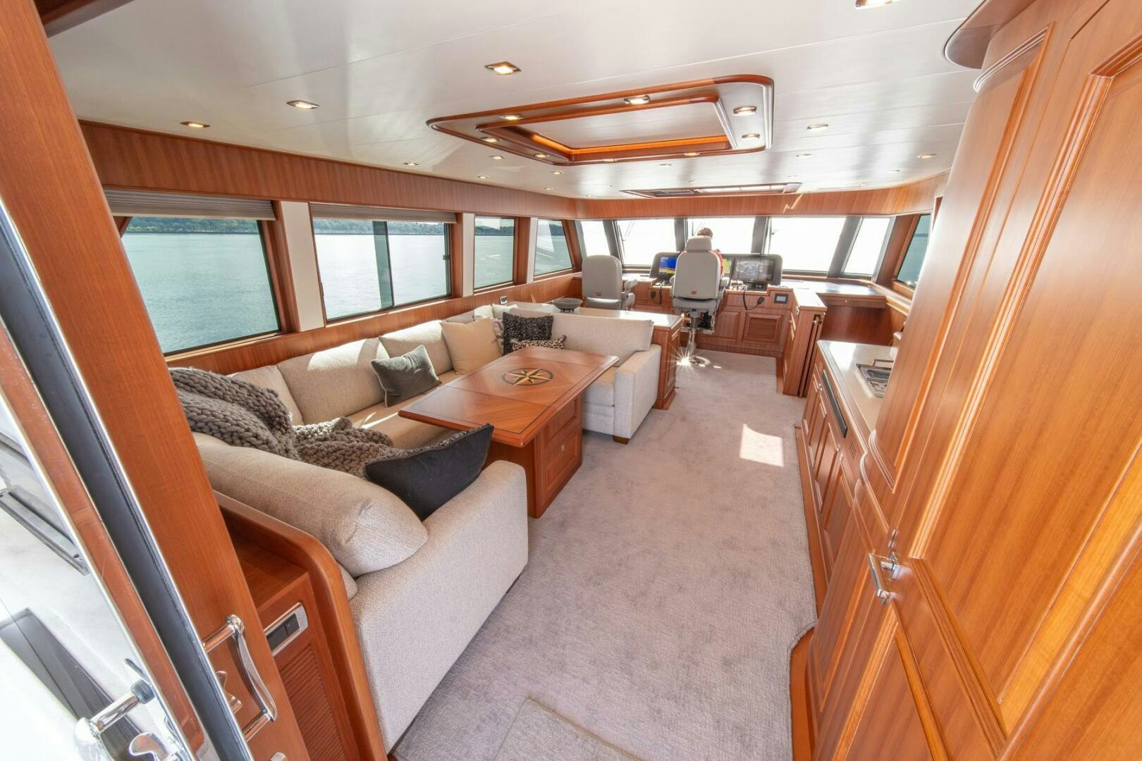 a living room with a couch and a table aboard ABRI SUR LA MER Yacht for Sale