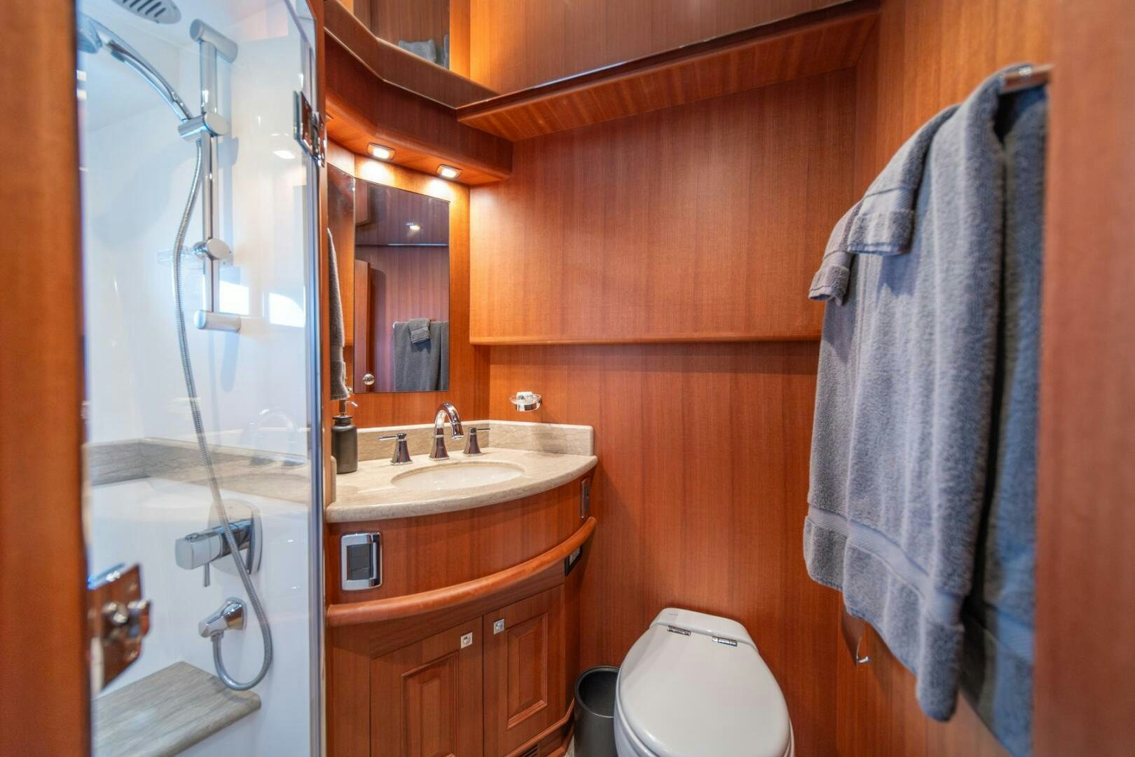 a bathroom with a shower and sink aboard ABRI SUR LA MER Yacht for Sale