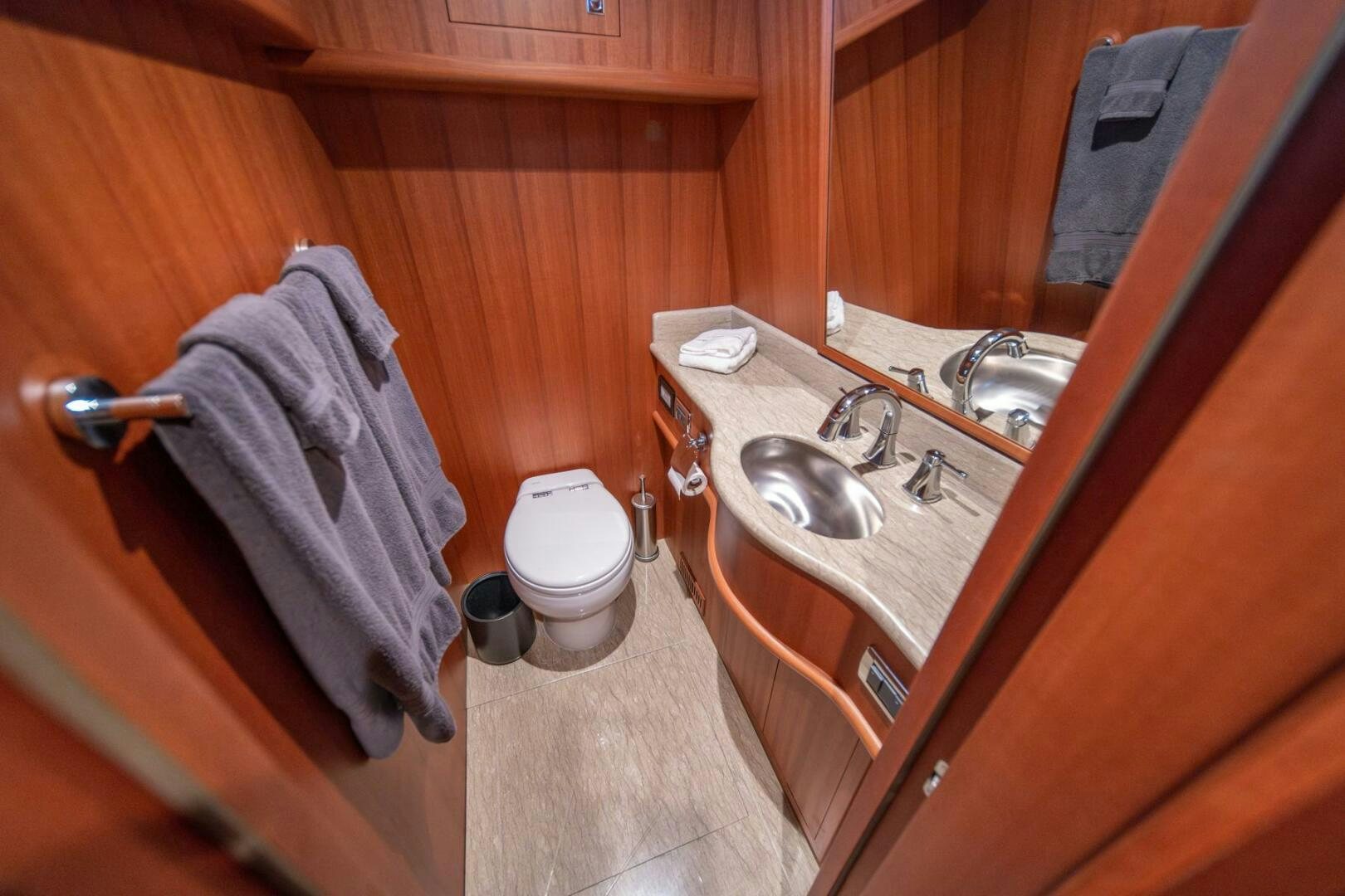 a bathroom with a sink and toilet aboard ABRI SUR LA MER Yacht for Sale