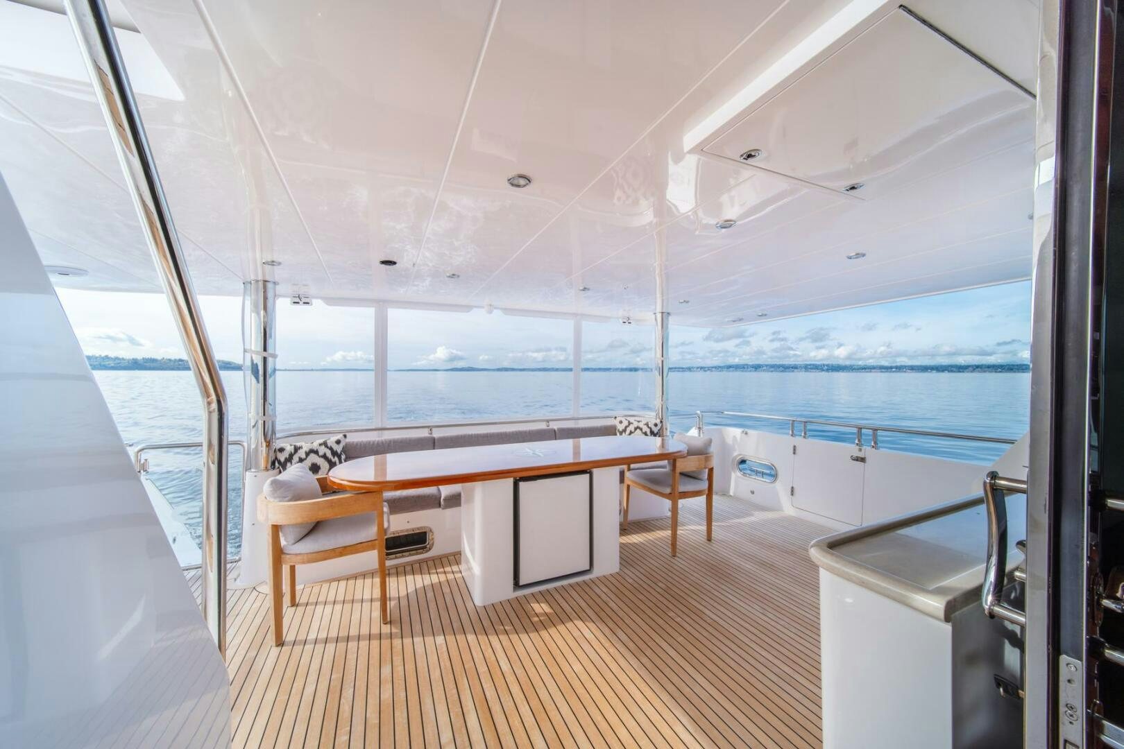 a room with a view of the ocean and a deck aboard ABRI SUR LA MER Yacht for Sale