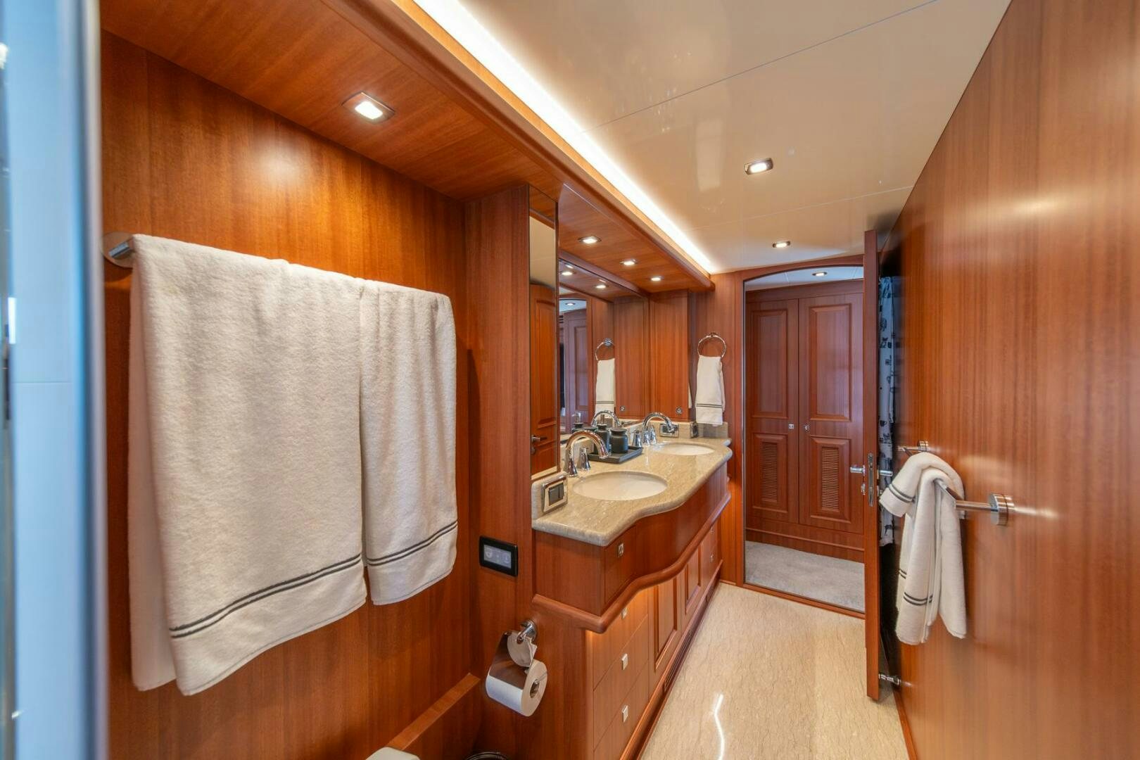 a bathroom with a sink and towels aboard ABRI SUR LA MER Yacht for Sale