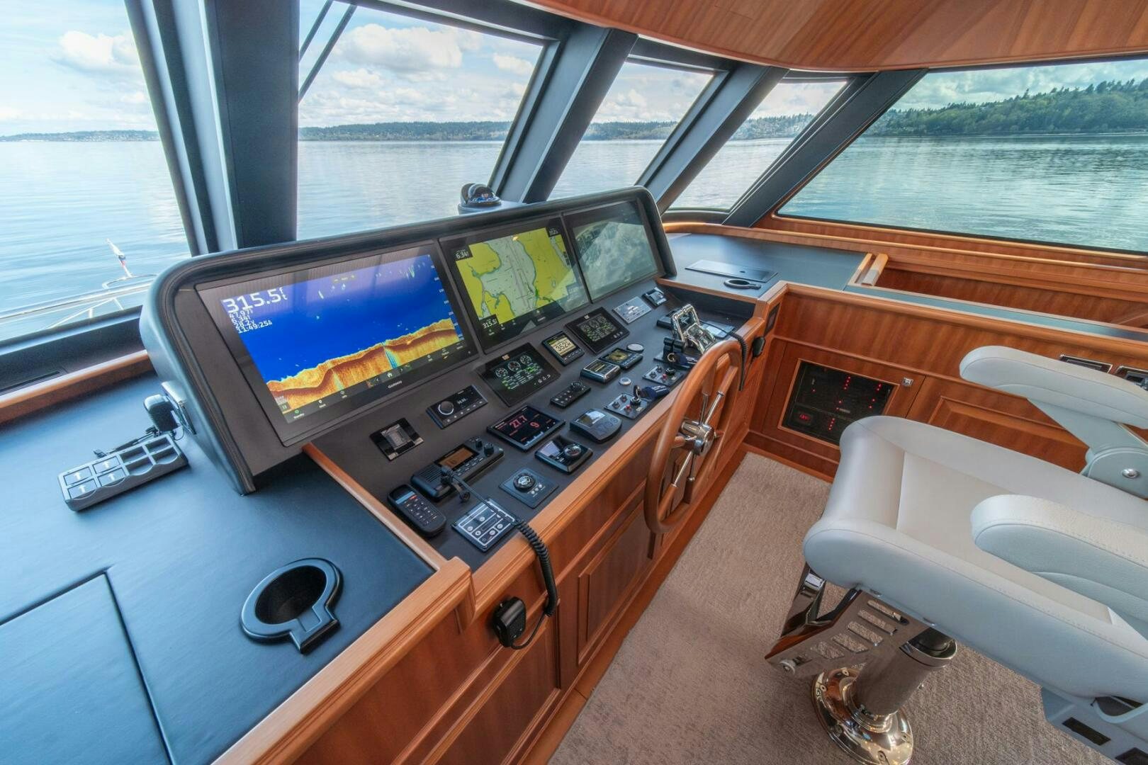 a small kitchen with a large tv aboard ABRI SUR LA MER Yacht for Sale