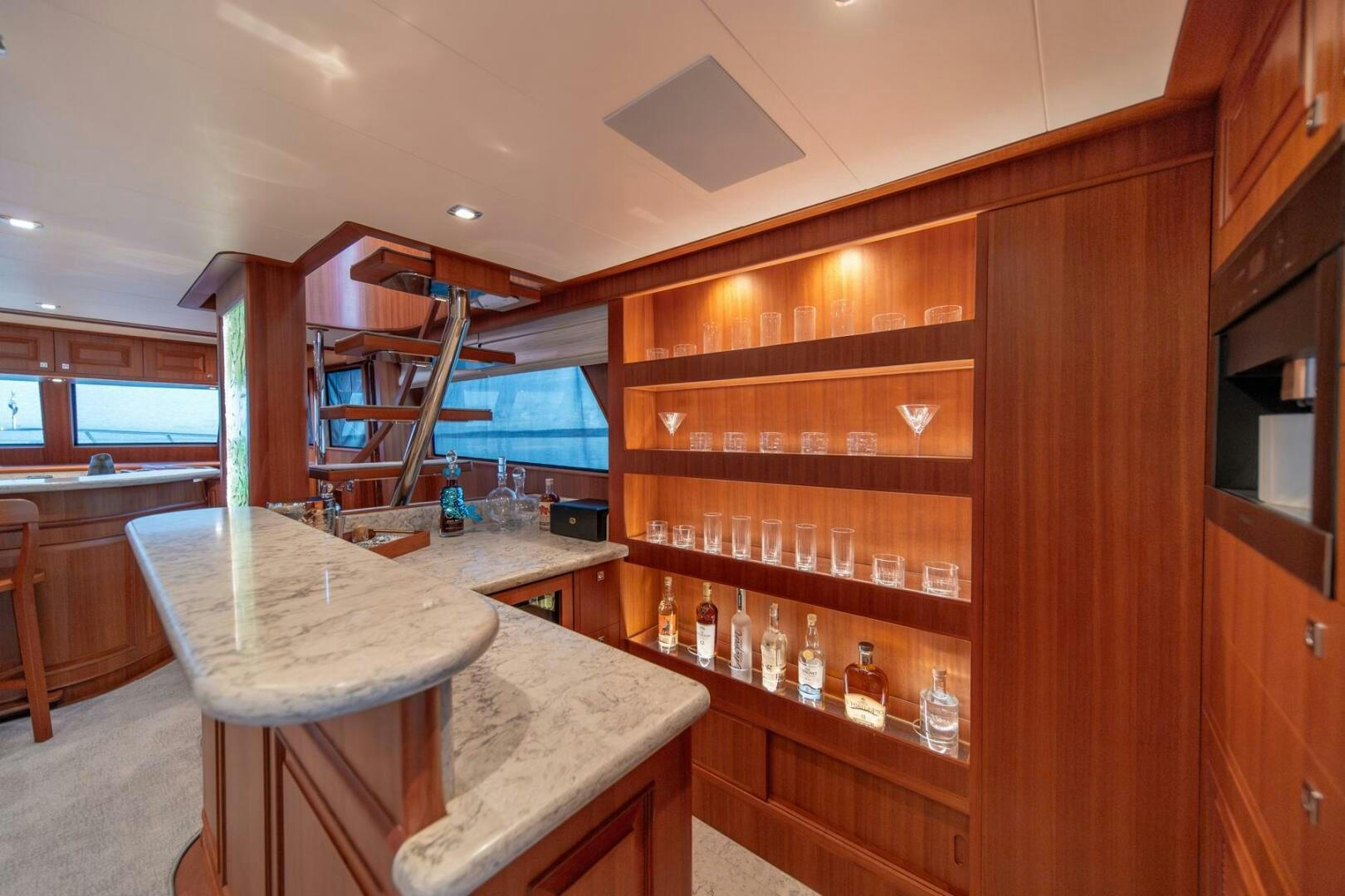a wooden kitchen with a table and cabinets aboard ABRI SUR LA MER Yacht for Sale