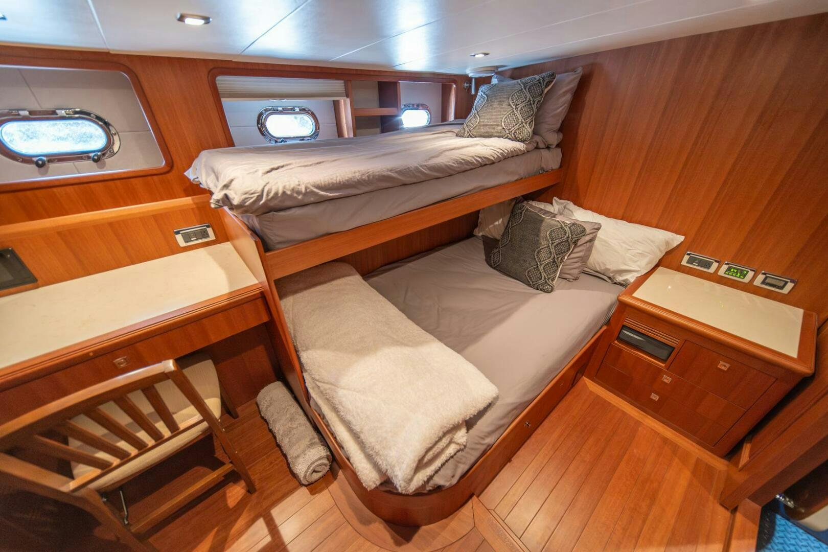a room with a bed and a table aboard ABRI SUR LA MER Yacht for Sale