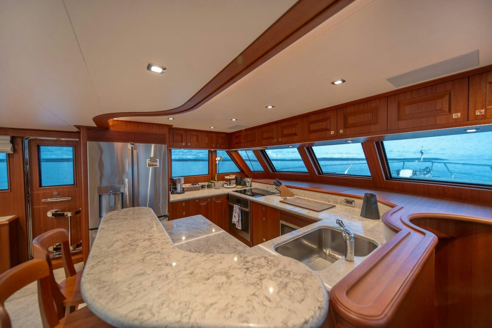 a kitchen with a large island aboard ABRI SUR LA MER Yacht for Sale